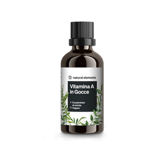 Una bottiglia di vetro marrone con la scritta "Vitamina A in Gocce" con tappo nero e motivo a foglie verdi, marchiata "natural elements".